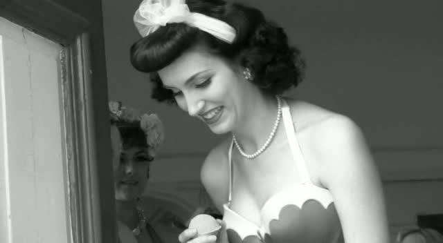 Bathing Beauties film still showing a performer preparing indoors