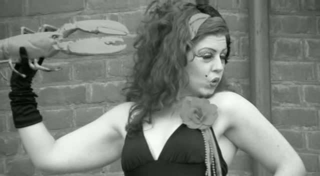 Bathing Beauties film still showing a performer holding a beach prop