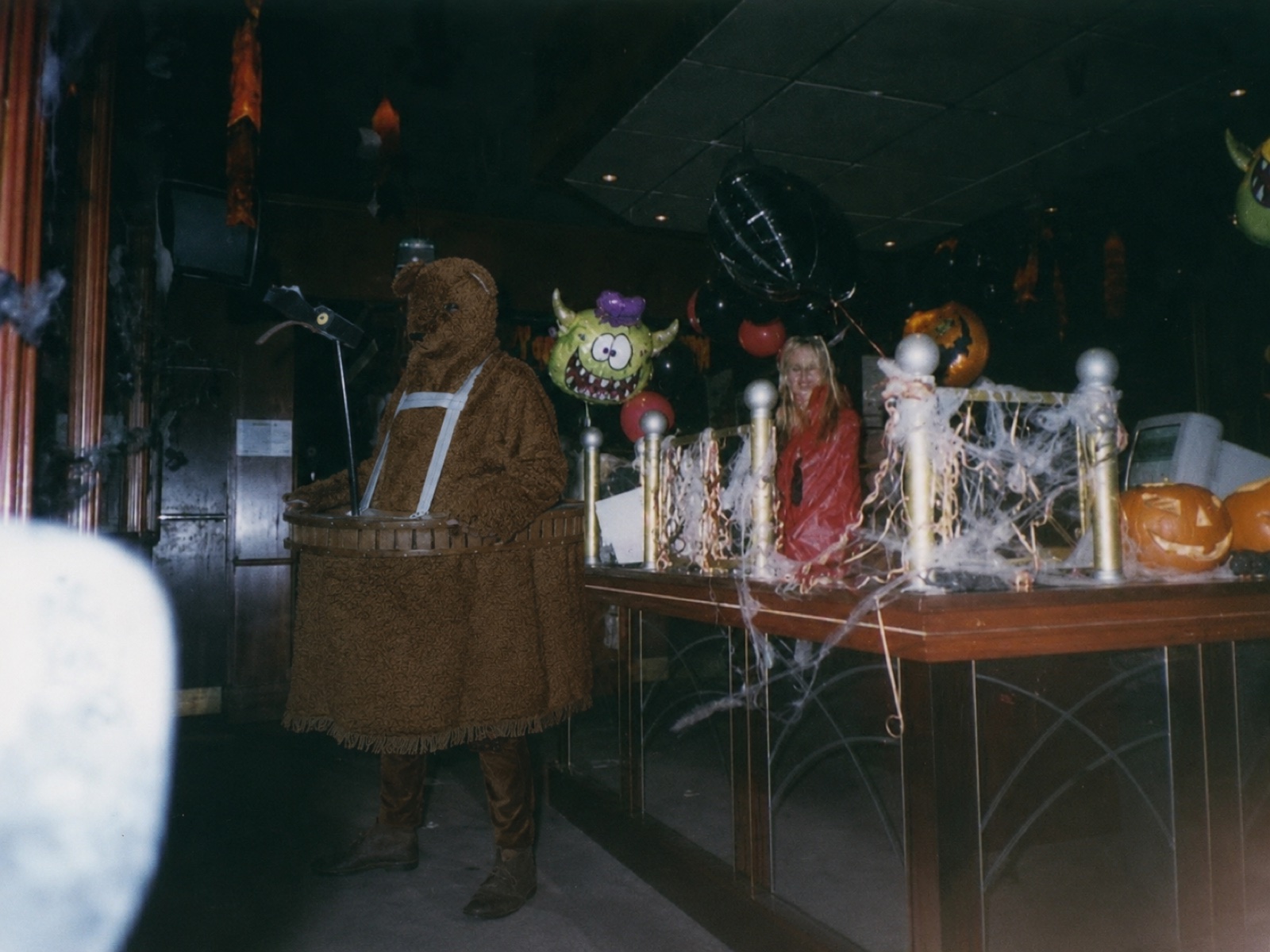 The Bear beside a Halloween-decorated nightclub bar