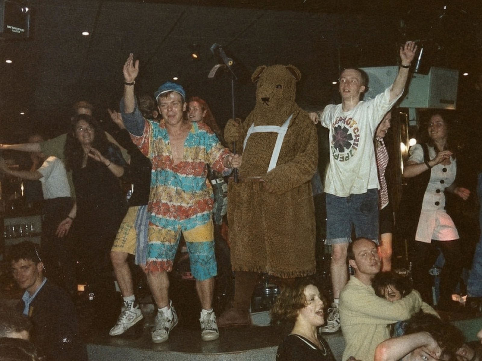 The Bear on a crowded nightclub stage