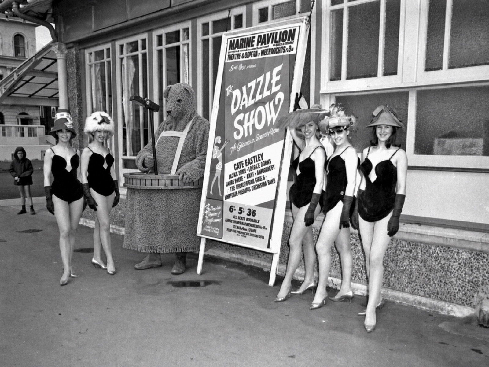 The Bear with Dazzle show dancers outside the Marine Pavilion