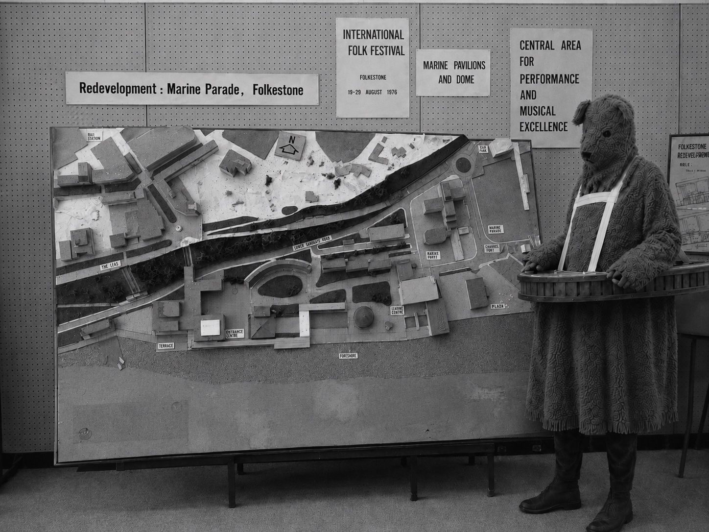 The Bear beside the Marine Parade redevelopment model at a civic exhibition