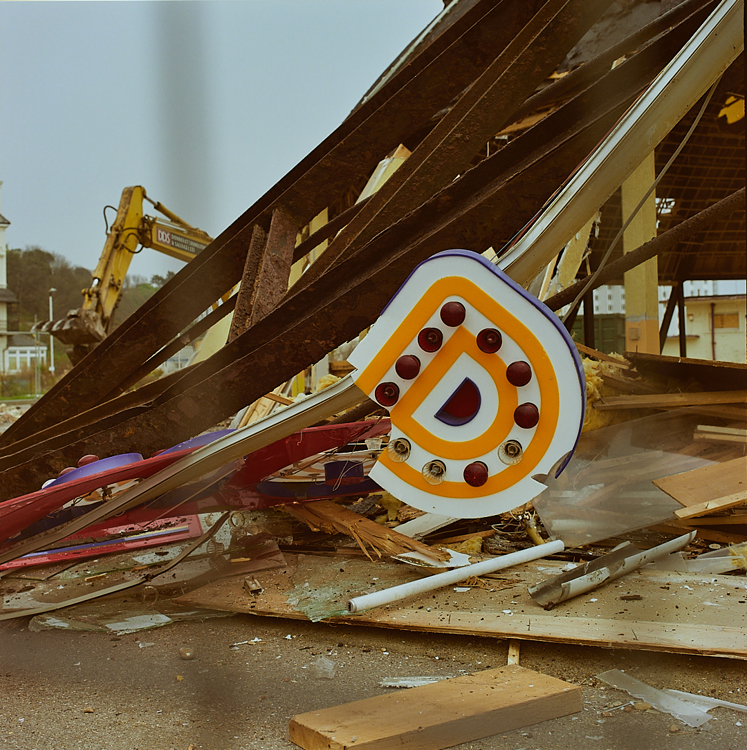 Fallen illuminated letter D from the Dome during demolition